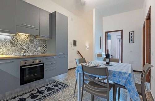 Sant'Antioco Apartment | A cozy and spacious 80 square meters apartment, perfect for four people, located on the first floor of a typical Sant'Antioco building (NO elevator).The property is located a short distance from the town center and offers quick access to the seafront. It