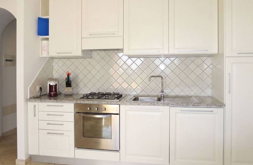 Porto Pozzo Apartment | Cosy apartment for 4 guests with A/C, WIFI, pool, TV, terrace and pets allowed