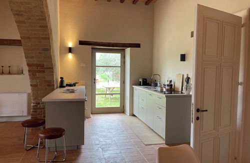Marsciano Apartment | Deluxe Cypress Suite: vaulted living room and pool