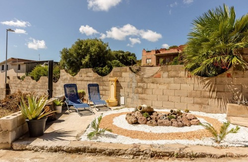 Nuraxi Figus Villa | GuestHost - A welcoming and spacious 100-square-meter villa, perfect for seven people, featuring a private entrance and private outdoor parking for two vehicles.The property is located in Nuraxi Figus, a quiet hamlet of Gonnesa: from here, guests can vis