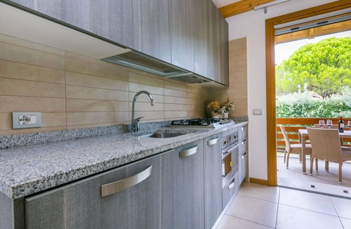 Lignano Sabbiadoro House | Nice apartment in villa for 8 guests with hot tub, pool, WIFI, A/C, TV, terrace and pets allowed