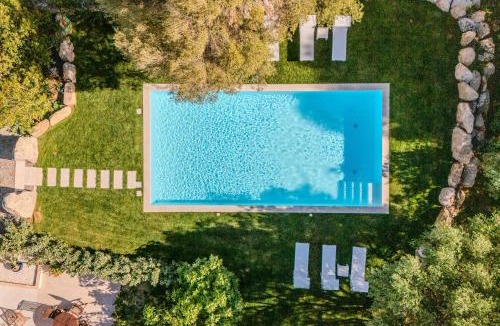 Buddittogliu Straulas Apartment | STAZZO SAN TEODORO IL GINEPRO Piscina Condivisa
