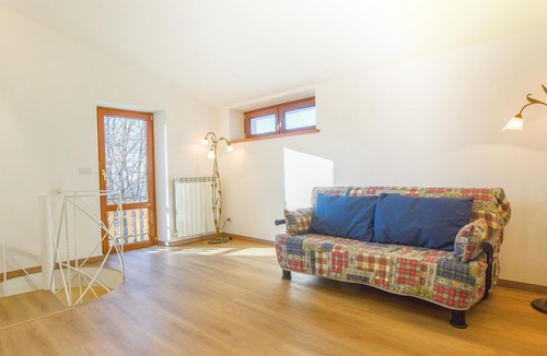Arcidosso House | Step into a spacious cottage with tile floors and cozy corners where you can retreat.
