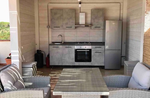 Nuraxi Figus Apartment | Villa Nuragica – Apartment with Outdoor Kitchen and Terrace with View